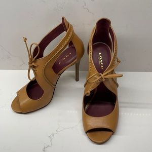 Meow!!! Sexy coach heels.